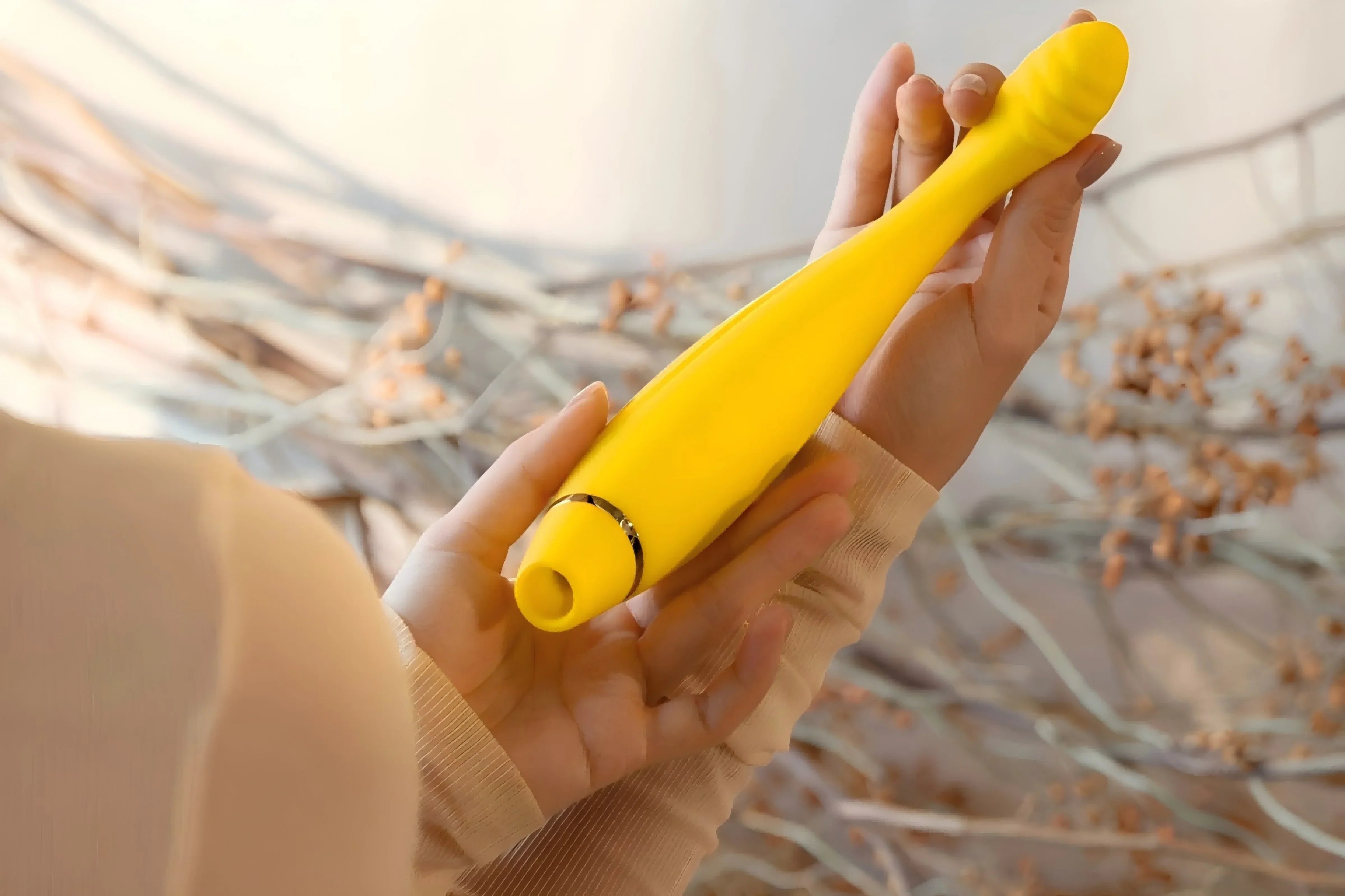 SHEVEREIGN blog banner image showing a woman’s hand holding a yellow vibrator, symbolizing safety, awareness, and confidence in learning how to use intimate products responsibly