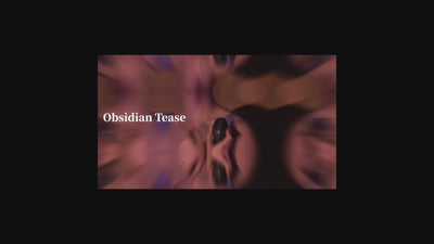 SHEVEREIGN Obsidian Tease clit vibrator video thumbnail showcasing its black gold design with dual suction and licking stimulation in a sensual artistic motion