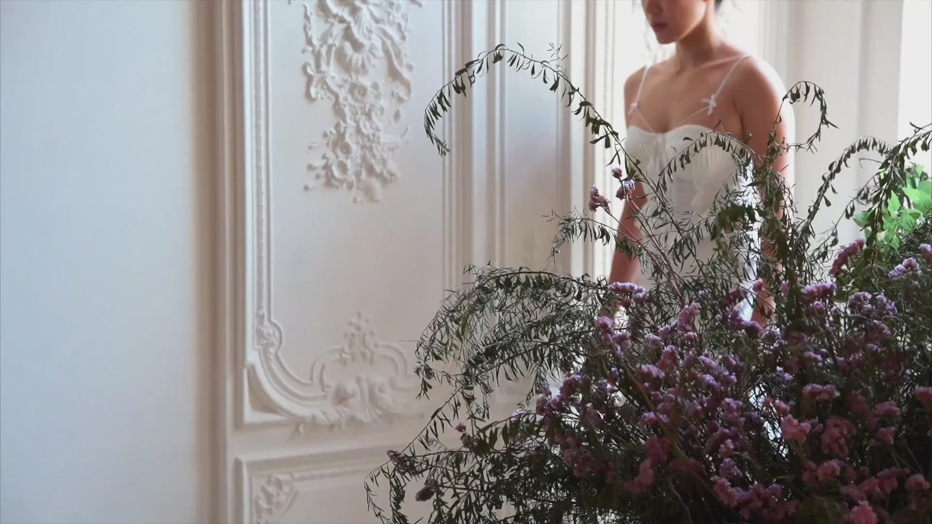 SHEVEREIGN OWN Series ambience video thumbnail featuring a woman in soft natural light surrounded by florals, expressing feminine confidence and modern intimate elegance