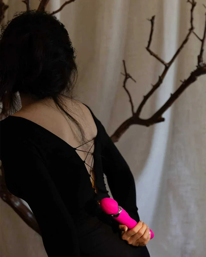 SHEVEREIGN Mighty Touch wand vibrator held with confidence, symbolizing empowerment and sensual energy in the Wand Vibrators category